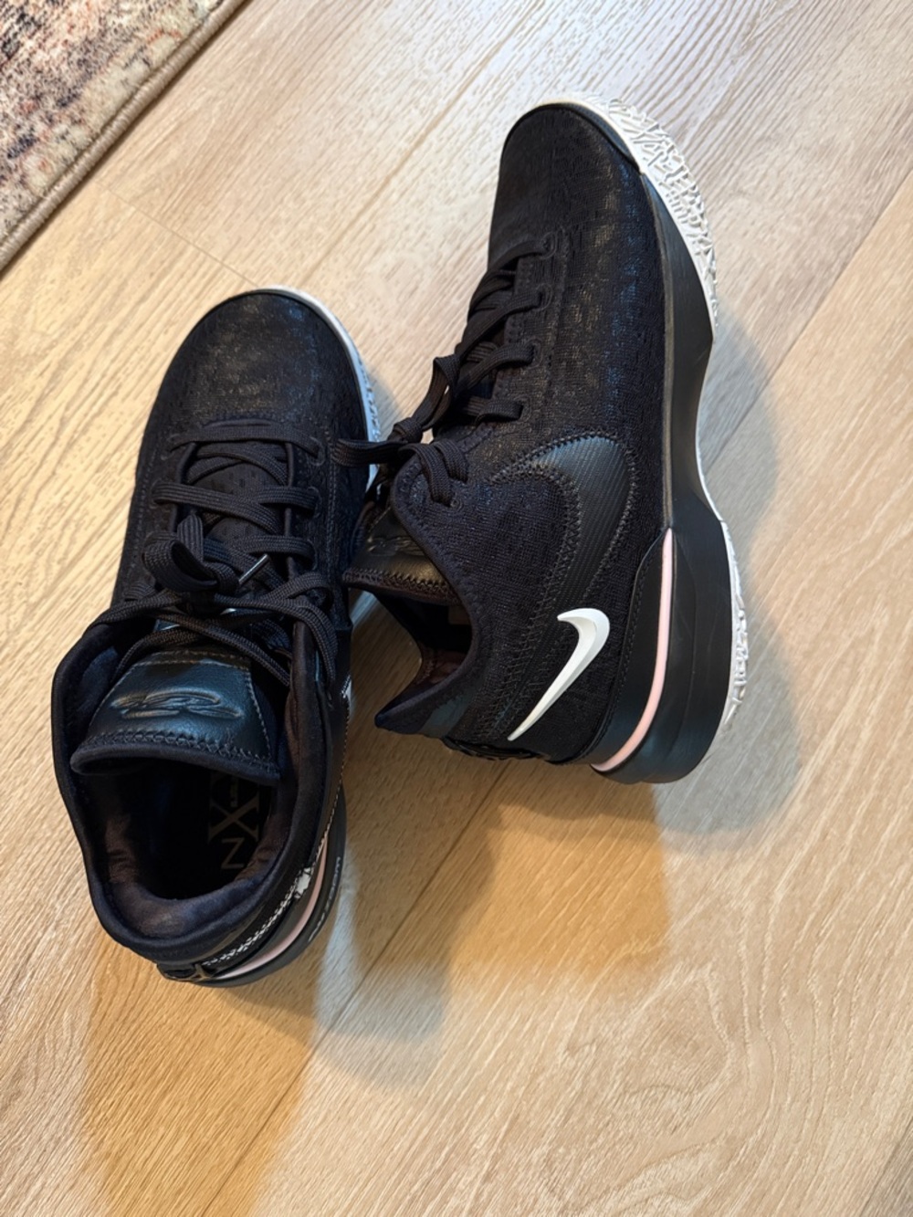 LeBron NXXT men’s  Black Athletic Sneakers with White Swoosh and Pink Accent